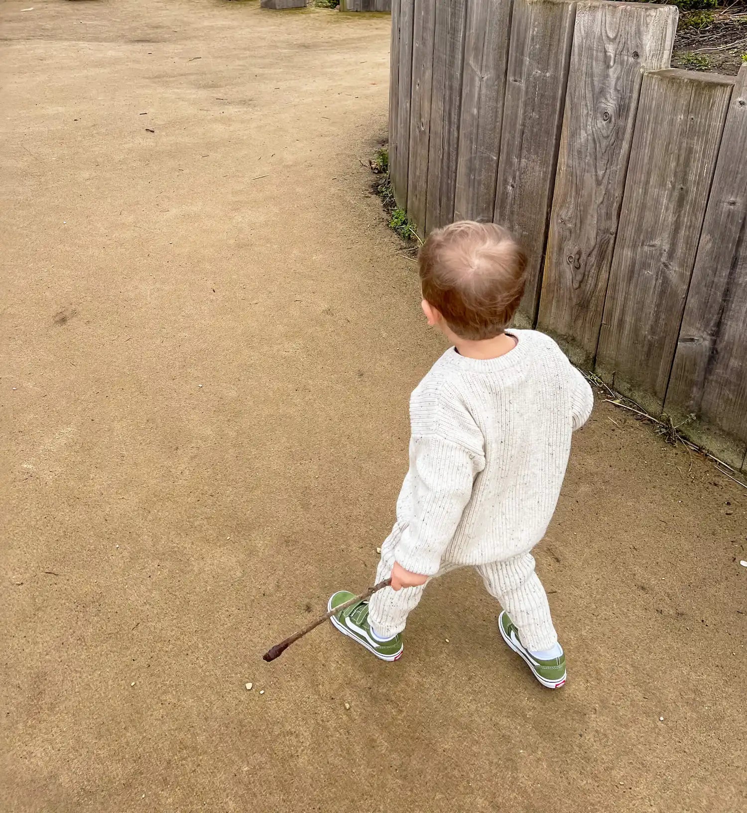 toddler wearing oversized chunky knit jumper in frosty speckle with matching leggings, stylish and cozy for a day of adventures