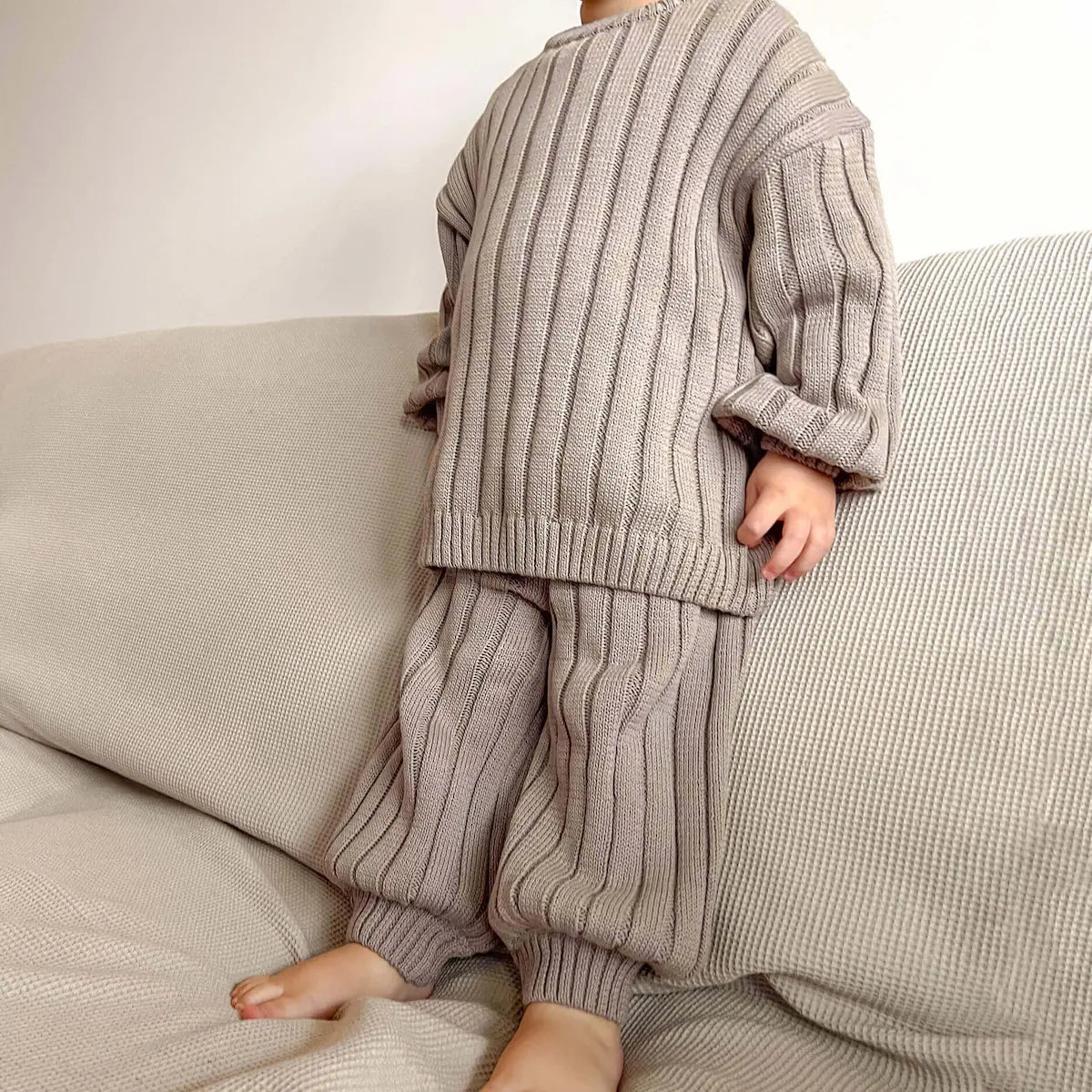 toddler dressed in the wide rib knit set in tottles beige, stylish and perfect for creating mix and match outfits